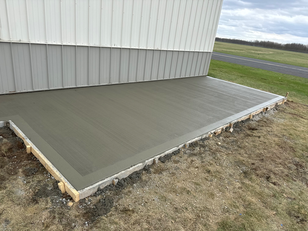 Prepared concrete slab beside a home